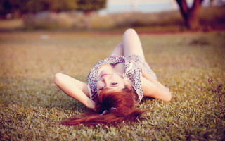 Woman grass blowing hair portrait - the wind free wallpaper for desktop