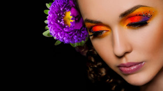 Woman bright orange yellow makeup - her hair and a flower free wallpaper