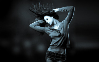Woman blowing hair black and - her hand behind her head free wallpaper