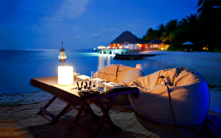 Beach night candle beanbag boat - a boat in the background free wallpaper