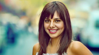 Smiling woman city street jewelry - shaded free wallpaper
