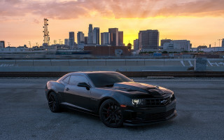 Black car city skyline sunset 2 - orange glow free wallpaper