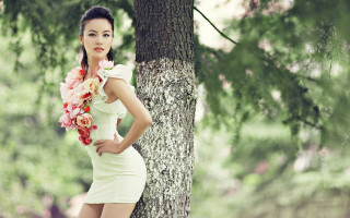 Woman flower dress tree nature - her hair and a flower free wallpaper