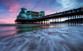 Pier building sunset waves city - wave free wallpaper