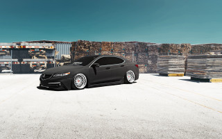Black car building pallets sky - a black car free wallpaper