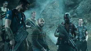Men guns cave smoke rocks - behind them free wallpaper
