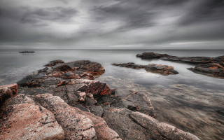 Rocky shore mountainous horizon moody - rich moody colour free wallpaper
