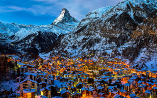 Snowy mountain town night lights - a mountain in the background free wallpaper