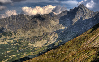 Mountain range clouds grassy fence 2 - auseklis ozol free wallpaper