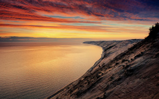 Sunset cliff water red sky 2 - a red sky in the background free wallpaper for desktop
