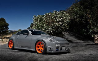 Gray car orange rims parking - a parking lot next free wallpaper