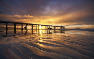 Pier sunset beach mountain ocean - a pier free wallpaper