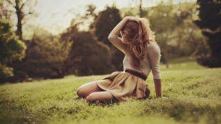 Woman sitting grass hands head - christabel dennison free wallpaper