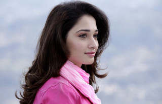 Woman pink jacket sky background - a pink jacket free wallpaper