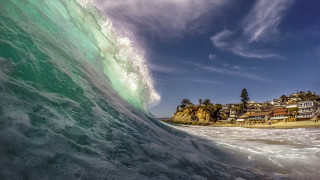 Large wave beach town horizon - over a beach free wallpaper
