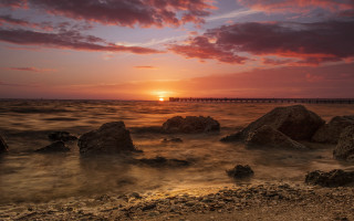 Sunset water rocks bridge cityscape - the distance free wallpaper