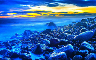 Rocky beach sunset blue sky - mystical free wallpaper