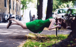 Upside down green dress bike - a surrealist painting free wallpaper