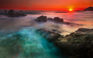 Sunset rocky beach mystical colors 6 - a sunset over a rocky beach free wallpaper