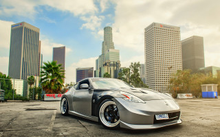 Silver sports car cityscape 3d - skyscraper free wallpaper