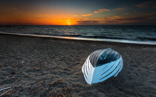 Sandy beach boat sunset ocean - exekia free wallpaper