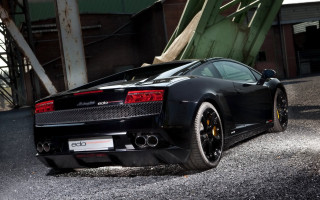 Black sports car parked green - a parking lot next free wallpaper