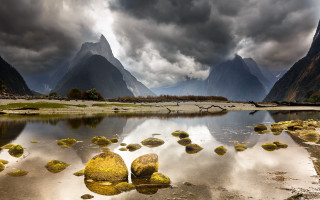 Mountain range ocean rocks cloudy - a body of water free wallpaper for desktop
