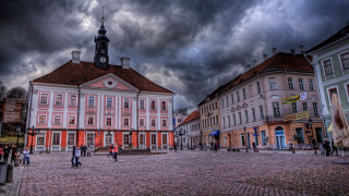 Cobblestone street group people city - a clock tower free wallpaper