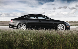 Black car tall grass cloudy - the side of a road free wallpaper
