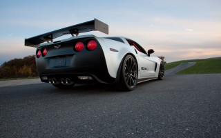 White black sportscar road sky 2 - a sky background and grass free wallpaper
