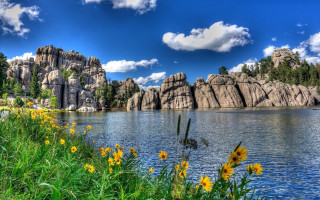 Lake rocks flowers blue sky - rock free wallpaper