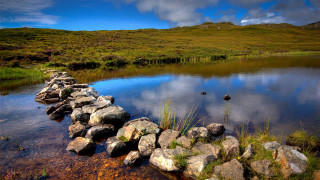 Stone wall water grassy hill - a stone wall free wallpaper
