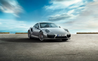 Silver sports car ocean clouds - a road near the ocean free wallpaper