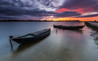 Boats sunset dusk clouds ocean - ferenc joachim free wallpaper