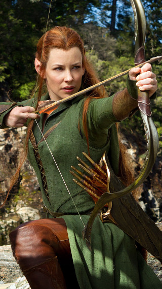 Woman green bow arrow serious - weta digital free wallpaper
