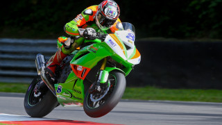 Motorcycle race track helmet blur - hard edge free wallpaper