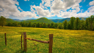 Fence field mountains clouds wooden - in a field free wallpaper