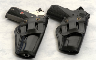 Black holsters silver laser belt - a white surface free wallpaper