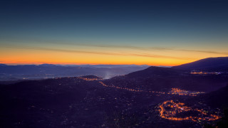 Cityscape hilltop sunset lights milky - a view of a city free wallpaper