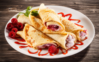 Crepes raspberries sauce wooden table - a wooden table top free wallpaper