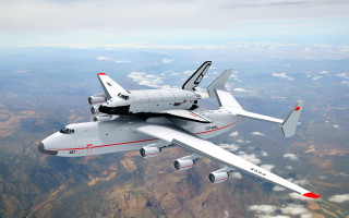 White airplane flying mountains red - the sky above a mountain range free wallpaper