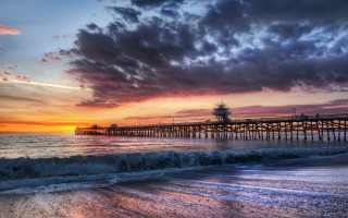 Sunset pier wave beach person - a pier free wallpaper