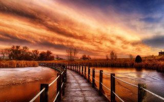 Wooden dock river sunset cloudy - a house in the distance free wallpaper