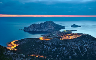 Mountain lake island night city - a small island in the middle of it free wallpaper
