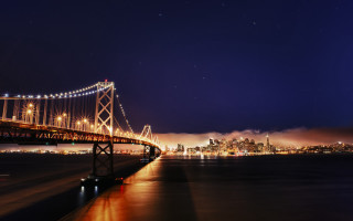 Bridge water city night lights 42 - a city in the foreground free wallpaper