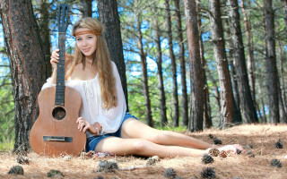 Woman woods guitar pinecones outdoors - a guitar free wallpaper for desktop