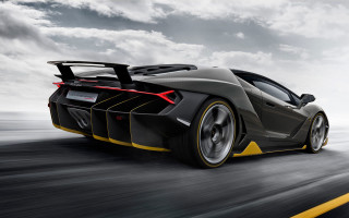 Black yellow sportscar driving clouds - side profile free wallpaper