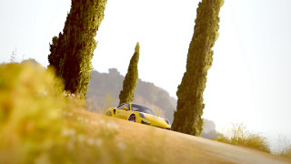 Yellow car hill trees nature - cinematic focus free wallpaper