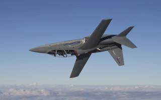 Gray airplane flying blue sky - cybernetic free wallpaper