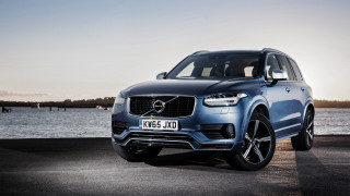 Blue volvo suv water boat 2 - a boat in the background free wallpaper